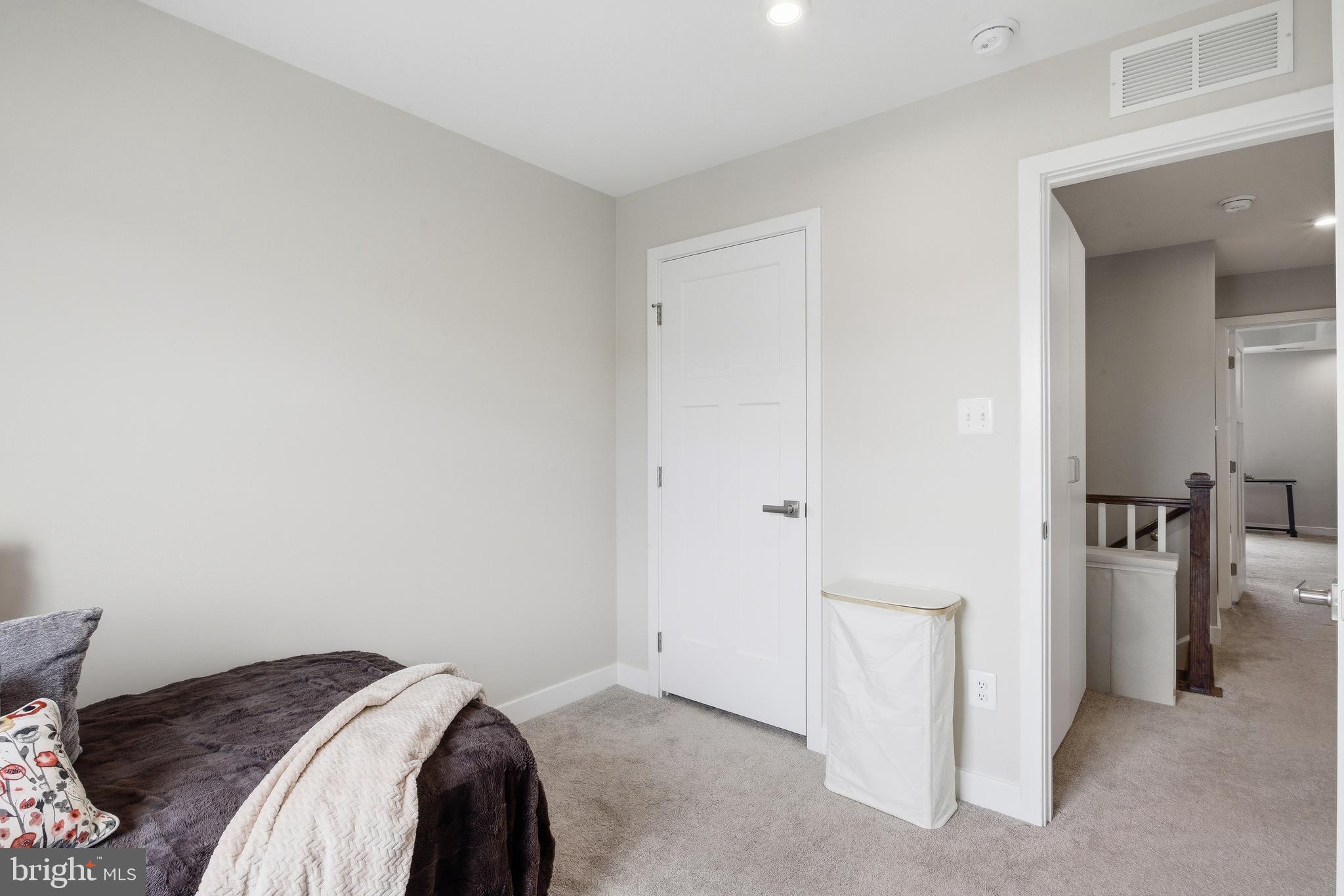 103 Freedom Way Sicklerville, NJ 08081 - Photo 27 of 43 a view of a bedroom with a bed and a hallway