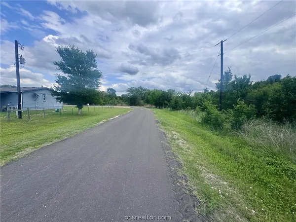 a view of a field with a big yard