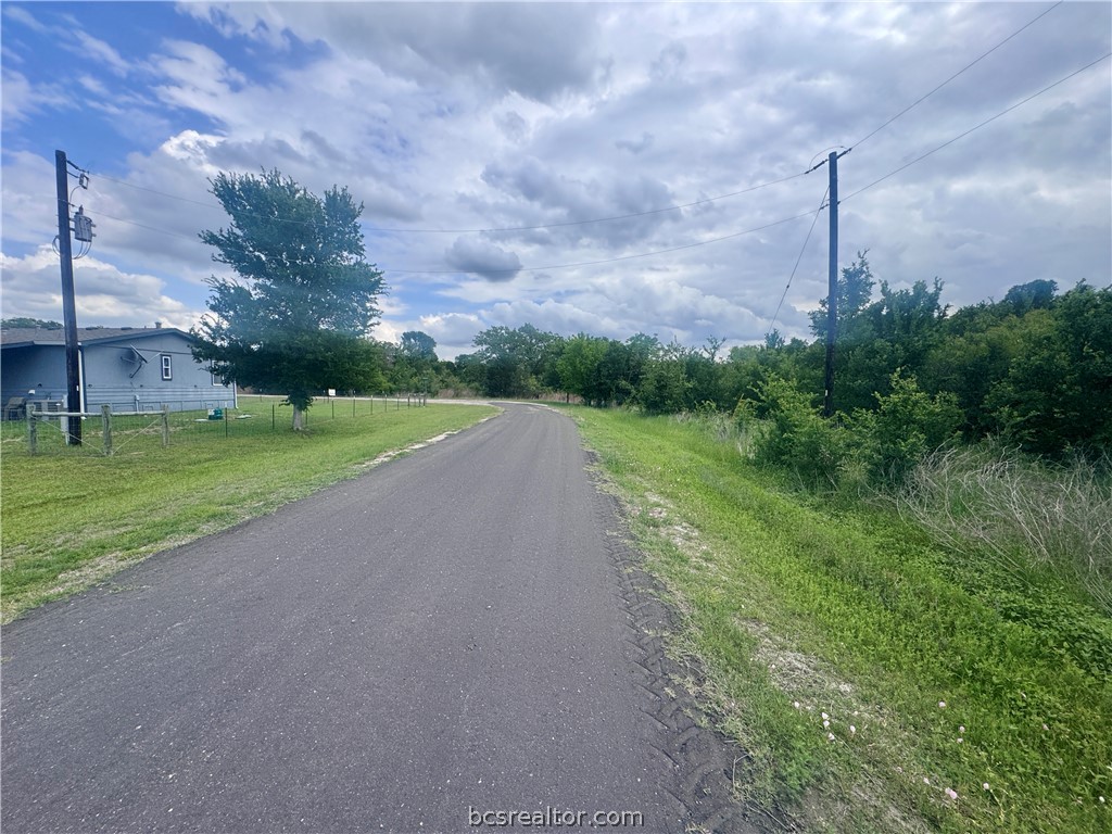 a view of a field with a big yard