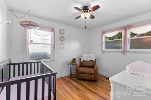 a bedroom with furniture and a window