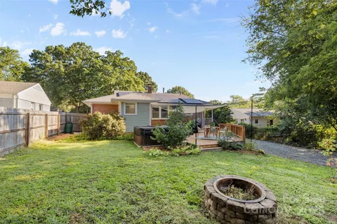 a view of a wooden deck and a yard