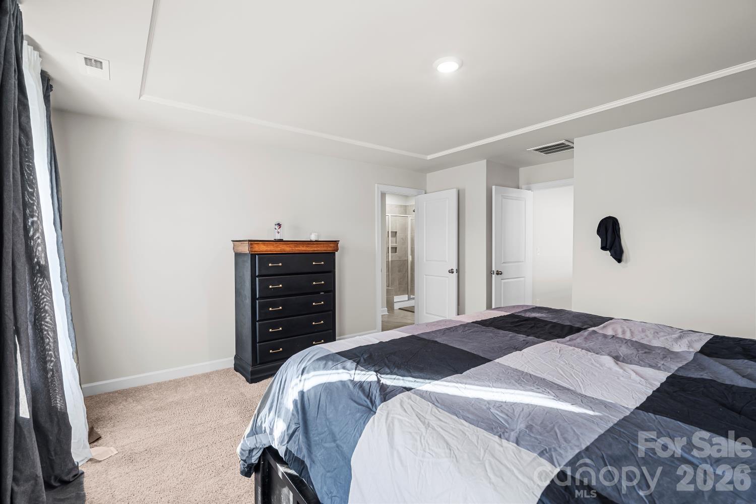 11955 Old Statesville Road Huntersville, NC 28078 - Photo 15 of 20 a bedroom with a bed and a dresser