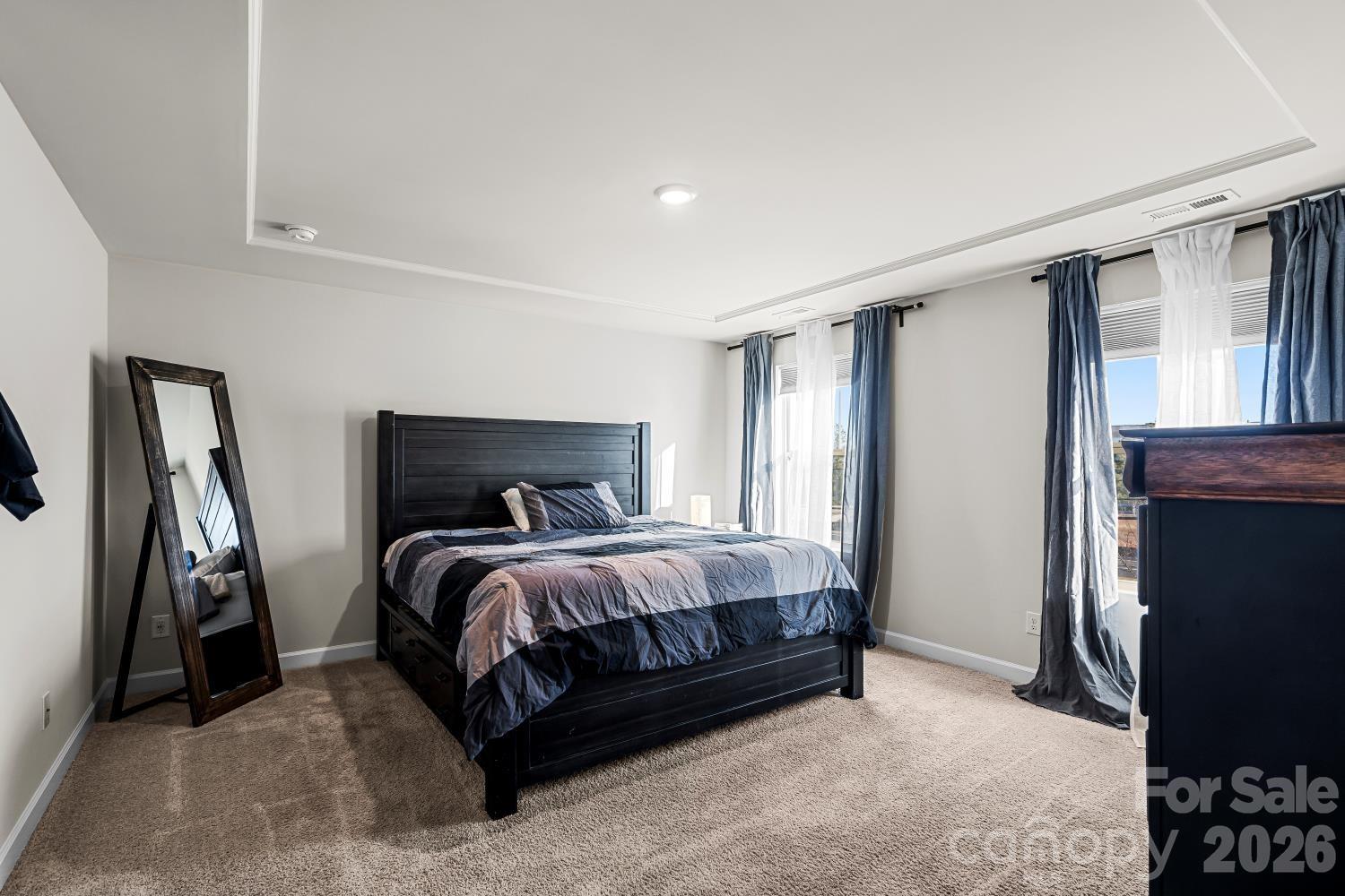 11955 Old Statesville Road Huntersville, NC 28078 - Photo 17 of 20 a bed sitting in a bedroom next to a window
