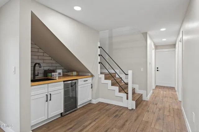 a bathroom with a double vanity sink mirror and toilet