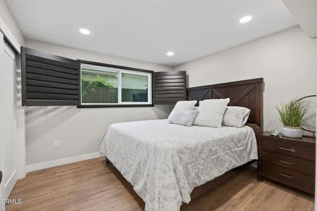 a kitchen with a sink kitchen island stainless steel appliances and white cabinets