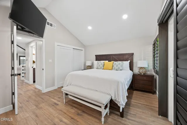 a view of a hallway view with wooden floor and staircase