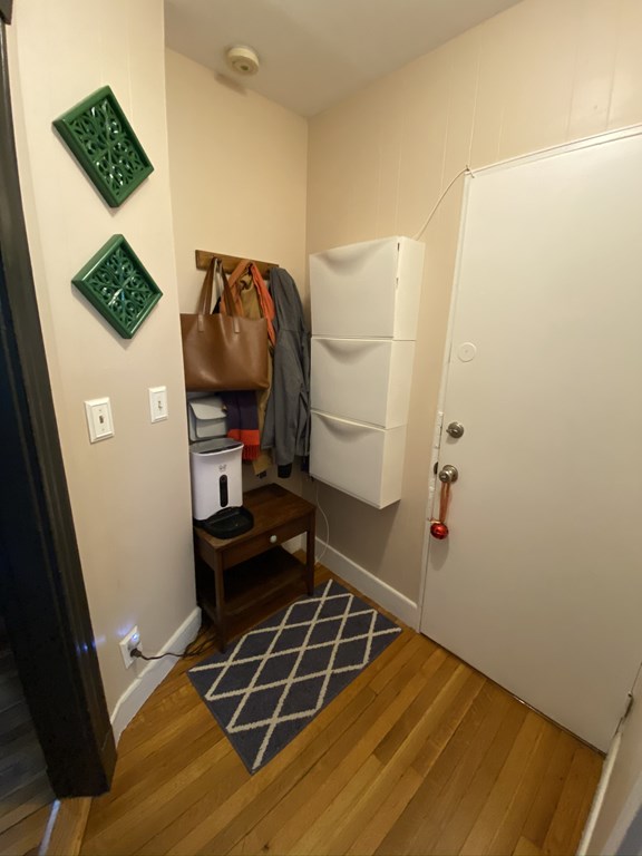 136 Broadway, Unit 3 Somerville, MA 02145 - Photo 8 of 11 a bathroom with a sink and a mirror