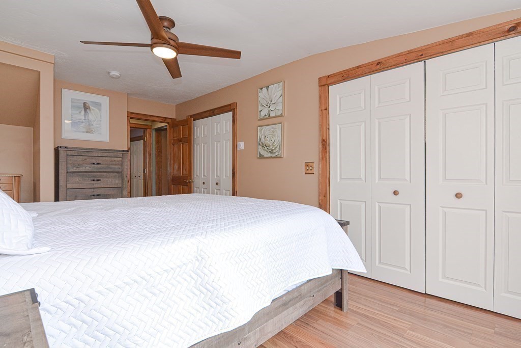 32 Allen Road Brookfield, MA 01506 - Photo 14 of 40 a bedroom with a bed and a chandelier