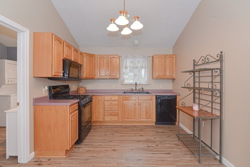 32 Allen Road Brookfield, MA 01506 - Photo 19 of 40 a kitchen with stainless steel appliances granite countertop a stove a sink and a refrigerator
