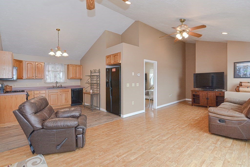 32 Allen Road Brookfield, MA 01506 - Photo 20 of 40 a living room with furniture and a chandelier