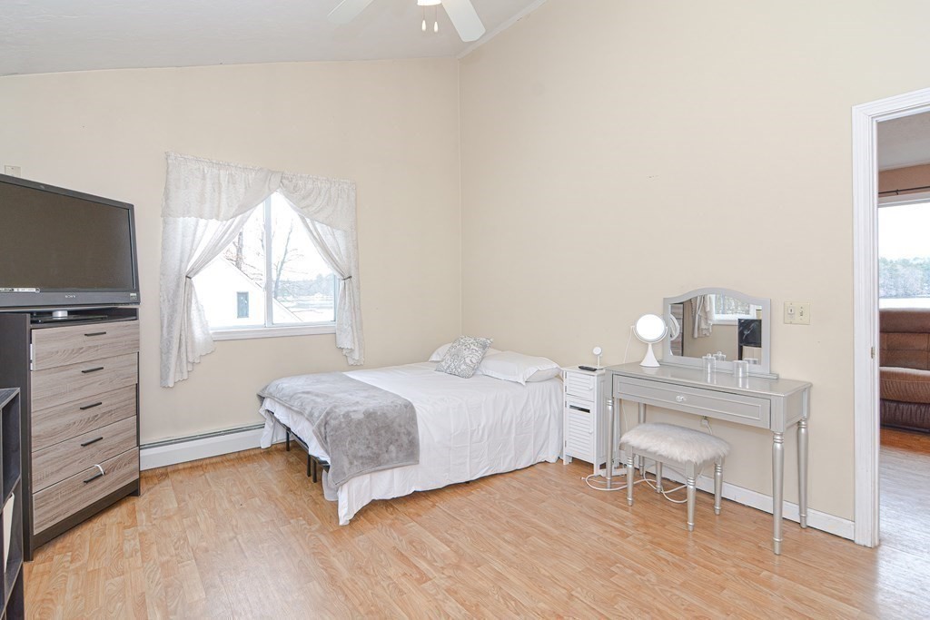32 Allen Road Brookfield, MA 01506 - Photo 26 of 40 a bedroom with a bed and a flat screen tv