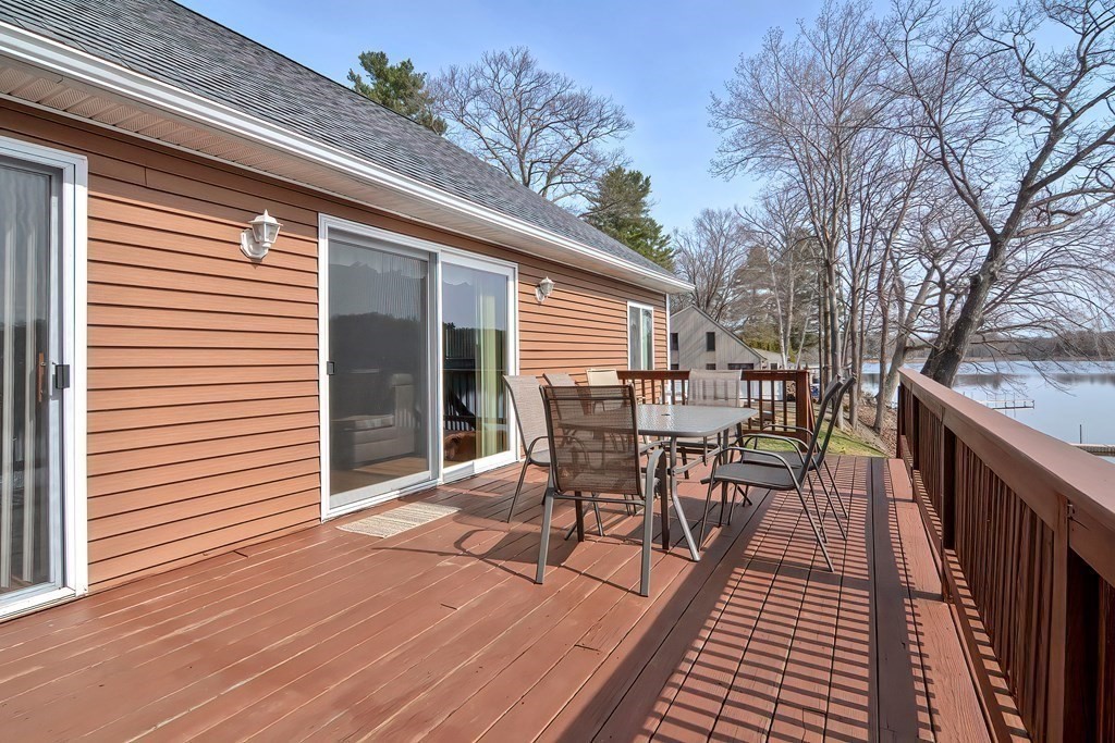 32 Allen Road Brookfield, MA 01506 - Photo 33 of 40 a patio with table and chairs and potted plants