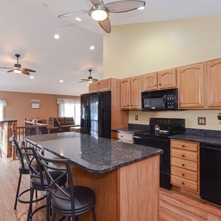 32 Allen Road Brookfield, MA 01506 - Photo 8 of 40 a kitchen with stainless steel appliances granite countertop a stove top oven a refrigerator a sink and dishwasher with wooden floor