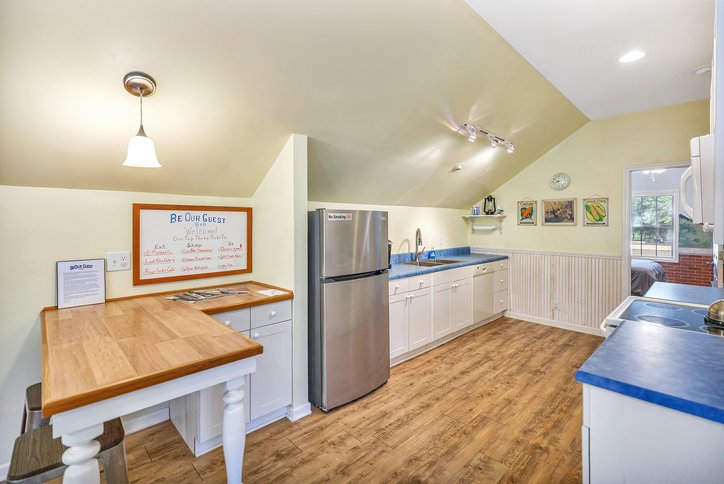 106 Pikes Ridge Anderson, SC 29626 - Photo 36 of 41 A spacious layout showcases rich wood-patterned flooring beneath a sloped ceiling.