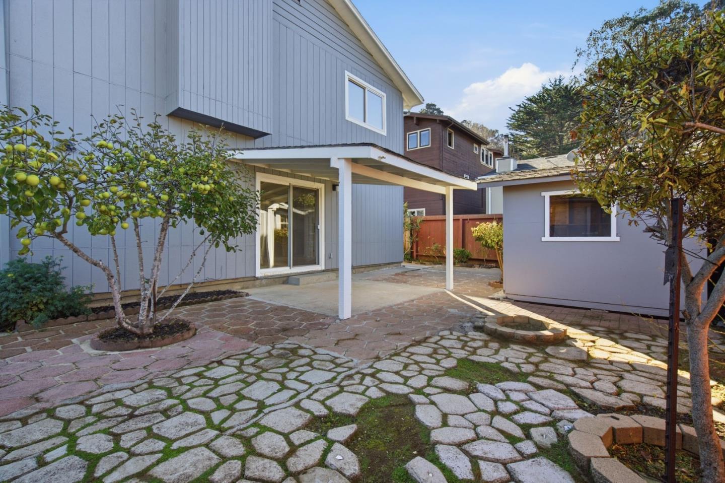 511 Buel Avenue, Unit B Pacifica, CA 94044 - Photo 9 of 9 a view of a house with a yard