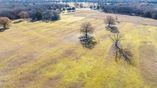 a view of a swimming pool and an outdoor space