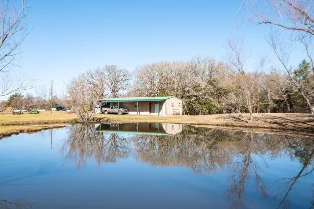 a view of a lake with houses in the background
