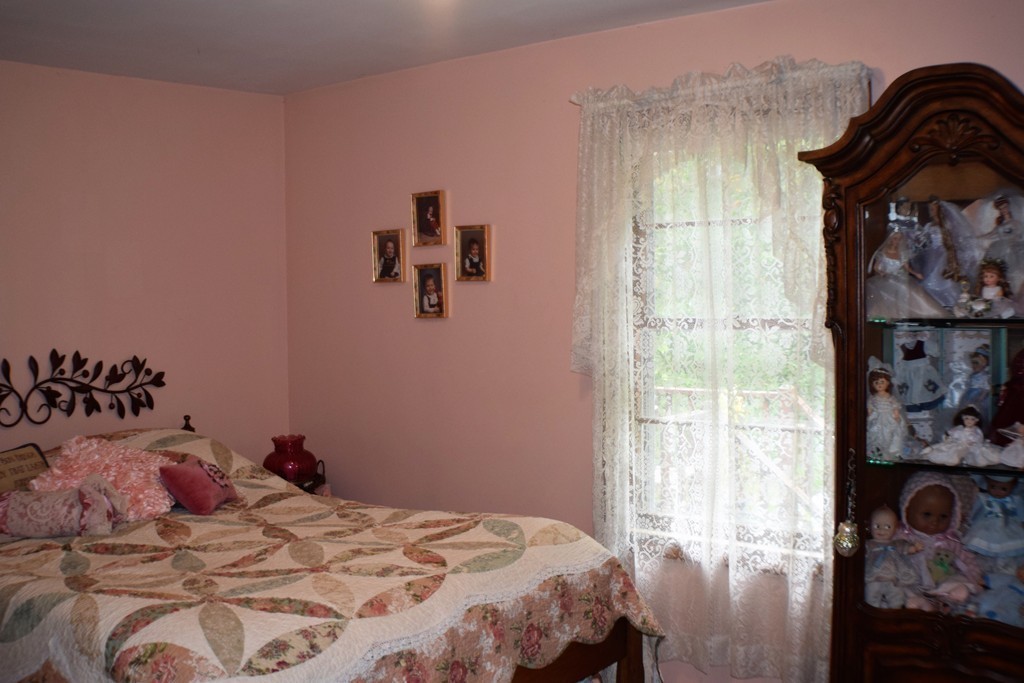 267 Wheelwright Road Barre, MA 01005 - Photo 17 of 29 a bedroom with a bed and a window