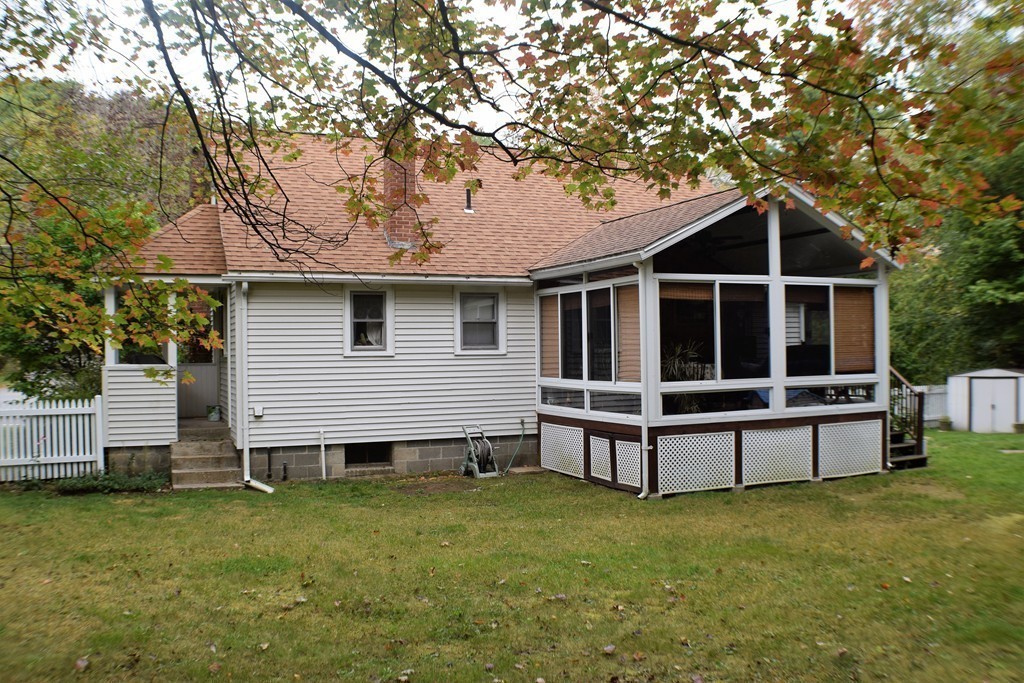 267 Wheelwright Road Barre, MA 01005 - Photo 25 of 29 a view of a house with a backyard and wooden fence