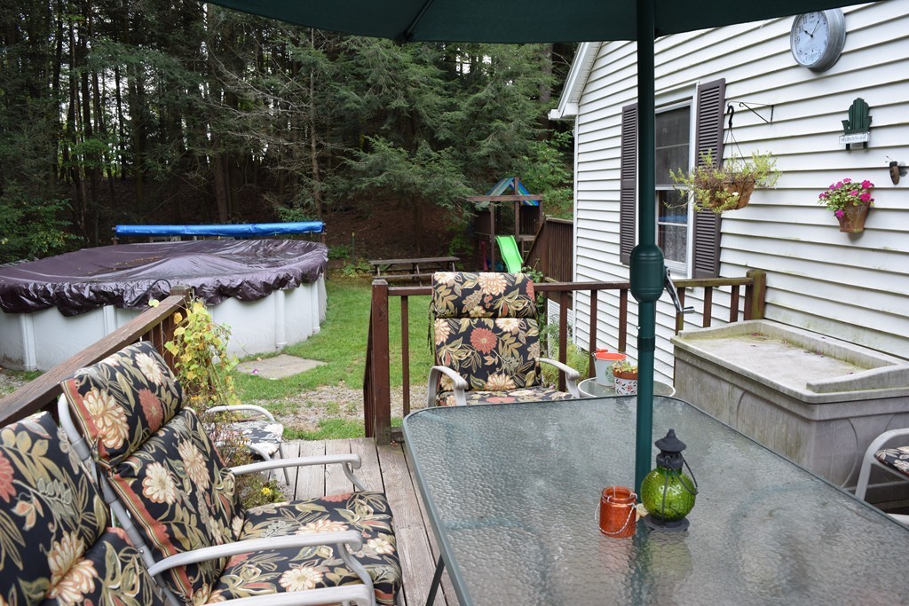 267 Wheelwright Road Barre, MA 01005 - Photo 26 of 29 an outdoor sitting area with chairs