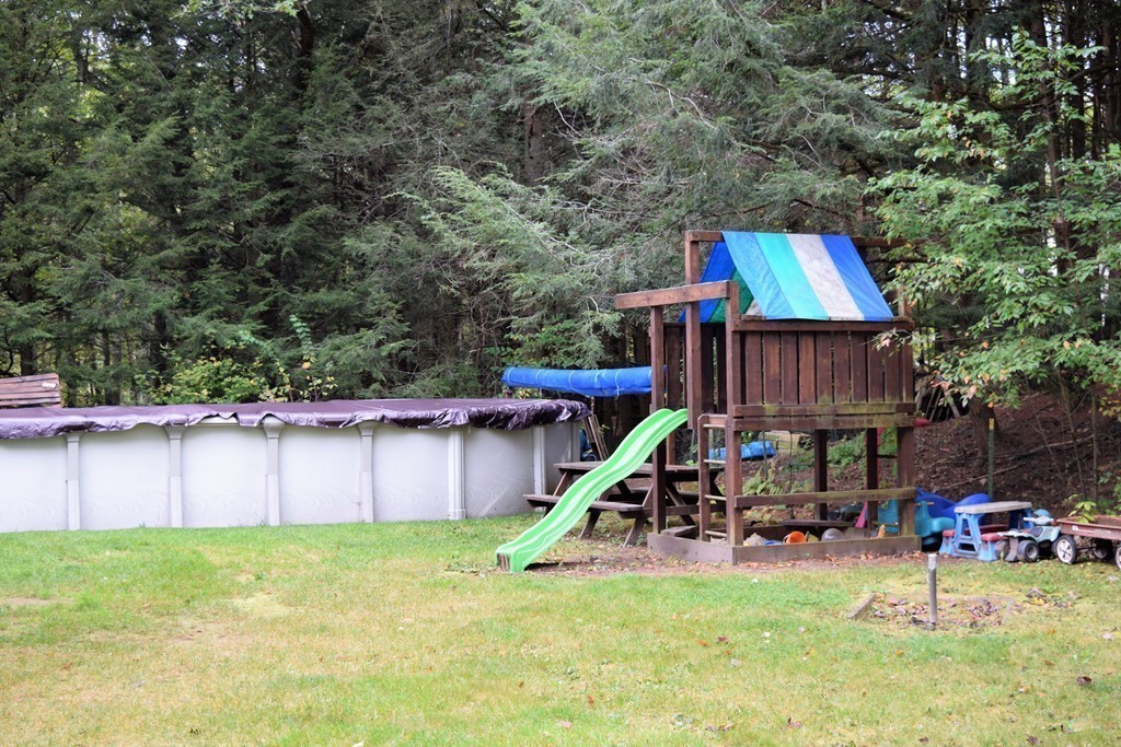 267 Wheelwright Road Barre, MA 01005 - Photo 27 of 29 a view of backyard with deck and slide
