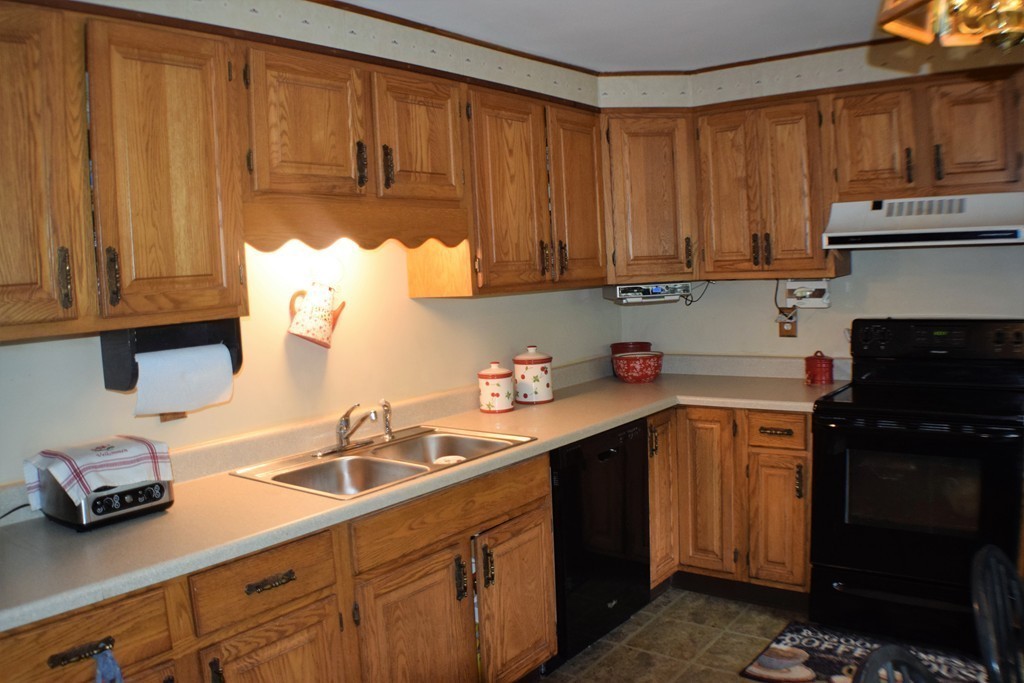 267 Wheelwright Road Barre, MA 01005 - Photo 3 of 29 a kitchen with stainless steel appliances granite countertop a sink stove and cabinets