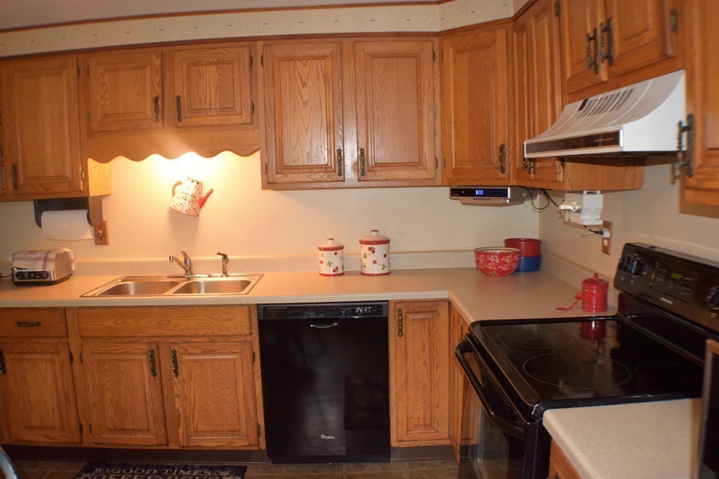 267 Wheelwright Road Barre, MA 01005 - Photo 4 of 29 a kitchen with stainless steel appliances granite countertop a sink stove and cabinets