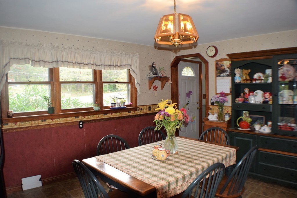 267 Wheelwright Road Barre, MA 01005 - Photo 6 of 29 a dining room with furniture a chandelier and window