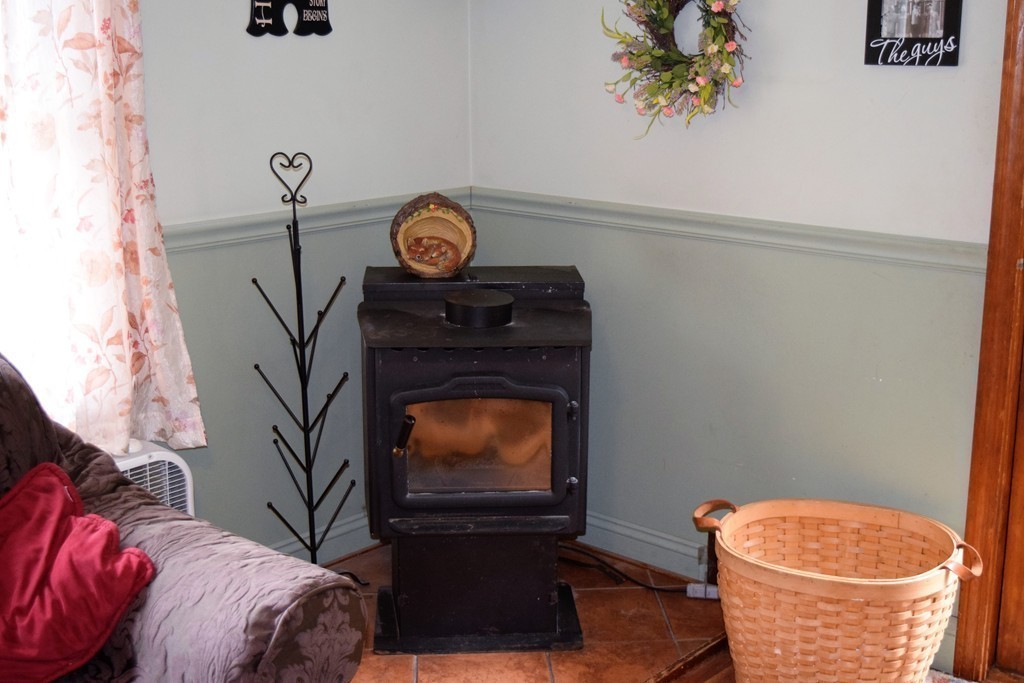 267 Wheelwright Road Barre, MA 01005 - Photo 8 of 29 a living room with furniture and a fireplace