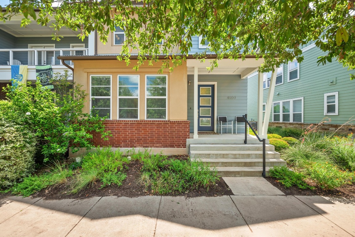 front view of a house with a yard