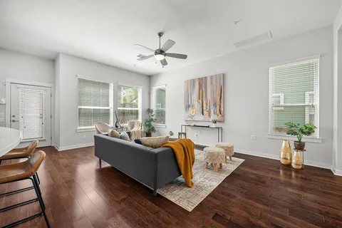 a living room with furniture and a large window