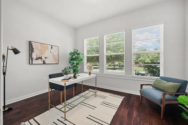 a bedroom with a bed and a view of kitchen