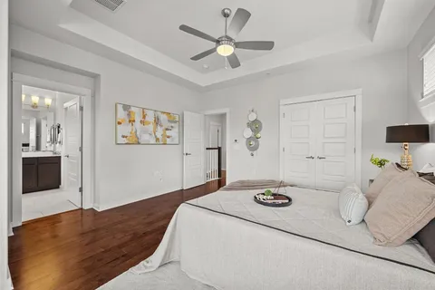 a bedroom with a bed and a view of kitchen