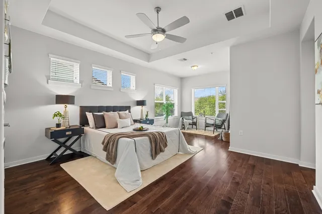 a bed room with bed and windows