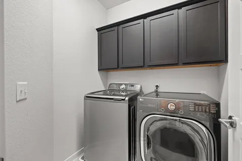 a view of storage and utility room with washer and dryer