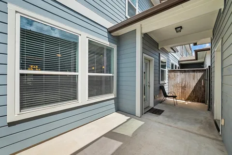 a view of a house with a door and wooden floor