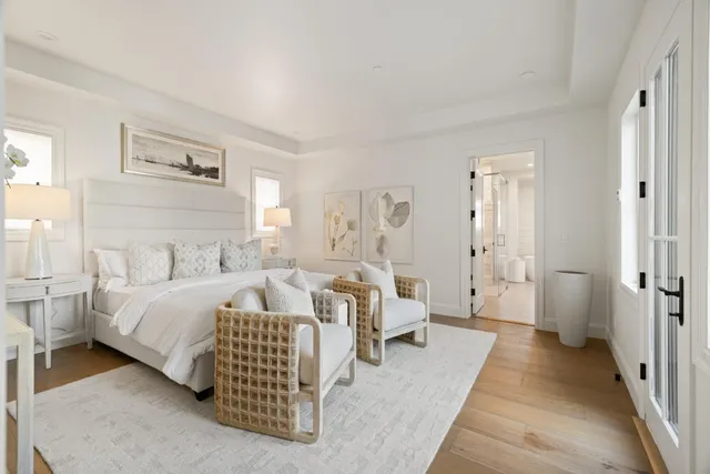 a spacious bedroom with a bed and a couch