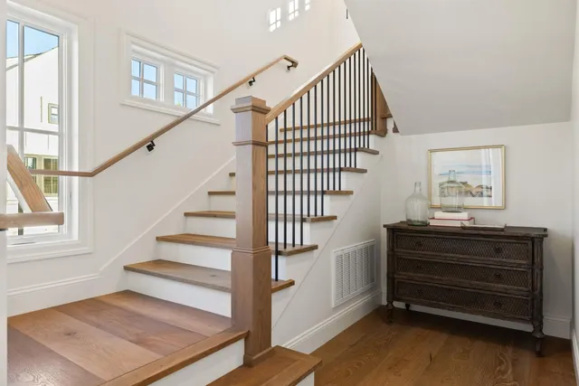 a view of entryway and hall with wooden floor