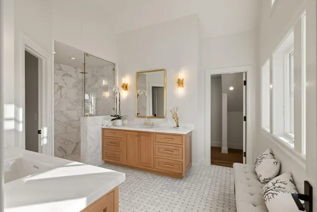a large bathroom with a double vanity sink mirror and double