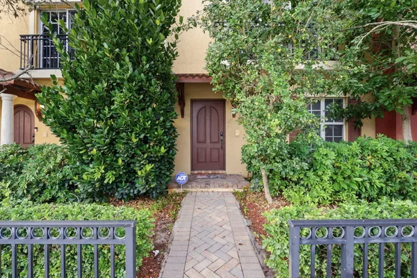 a view of a pathway with a garden