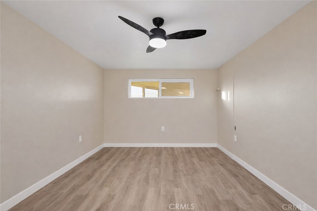 14695 Ocotilla Road Apple Valley, CA 92307 - Photo 11 of 16 an empty room with a window