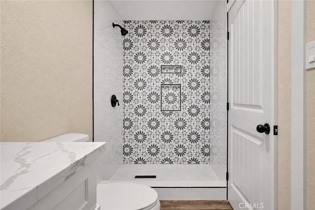 14695 Ocotilla Road Apple Valley, CA 92307 - Photo 12 of 16 a bathroom with a shower toilet and a sink