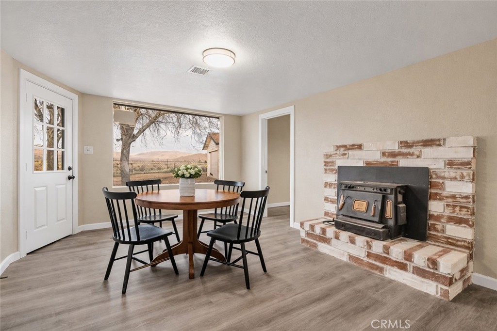 14695 Ocotilla Road Apple Valley, CA 92307 - Photo 15 of 16 a view of a livingroom with furniture and a fireplace