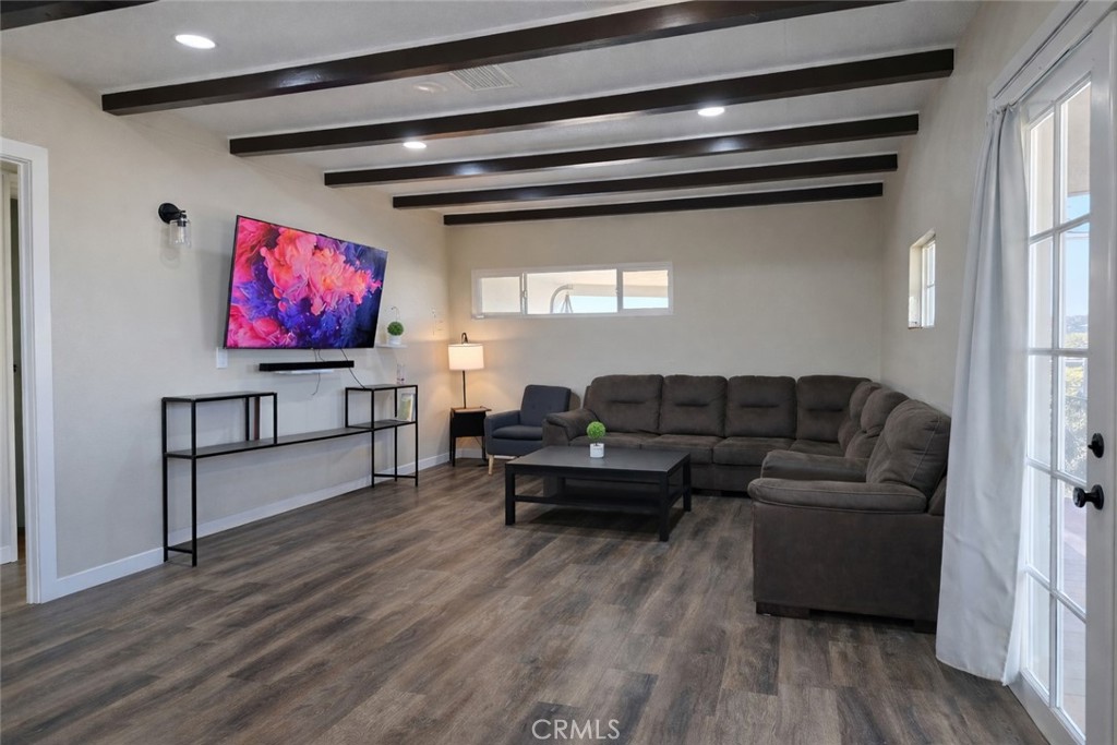 14695 Ocotilla Road Apple Valley, CA 92307 - Photo 6 of 16 a living room with furniture and a flat screen tv