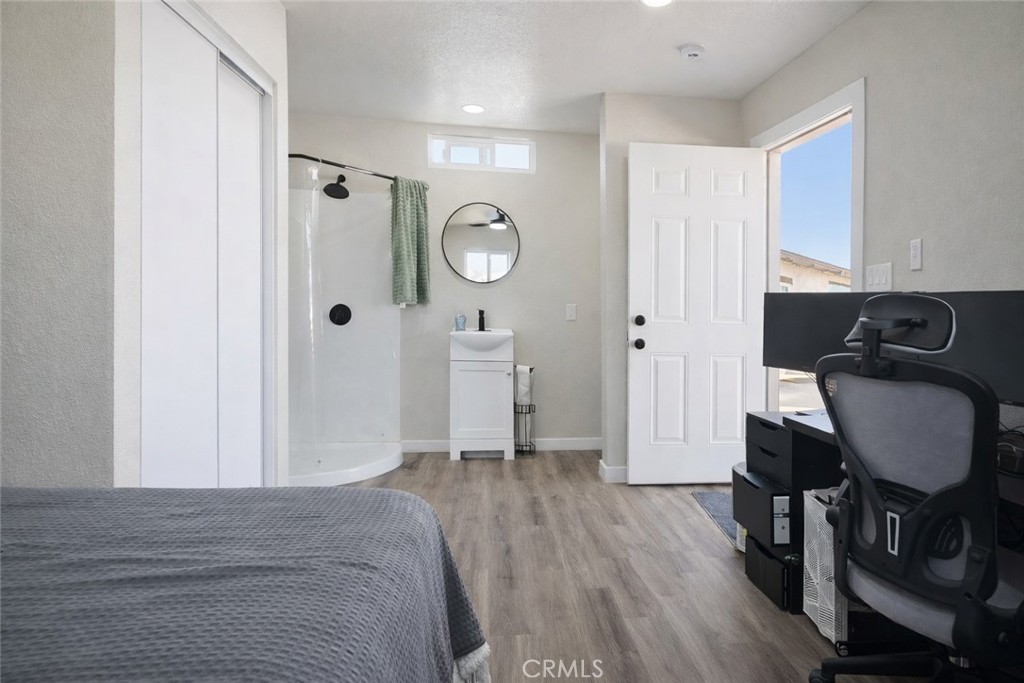 14695 Ocotilla Road Apple Valley, CA 92307 - Photo 8 of 16 a view of a room with wooden floor and chair
