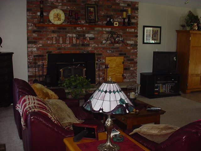 504 Meadowbrook Road Yakima, WA 98903 - Photo 15 of 18 a living room with furniture and a fireplace