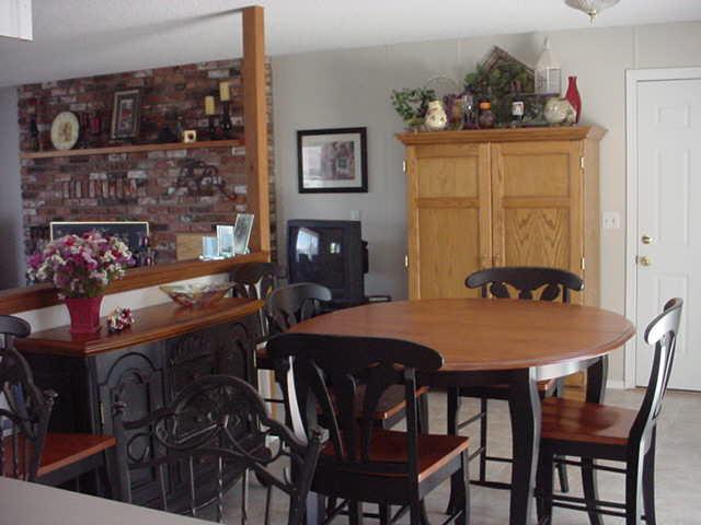 504 Meadowbrook Road Yakima, WA 98903 - Photo 8 of 18 a view of a dining room with furniture and chandelier