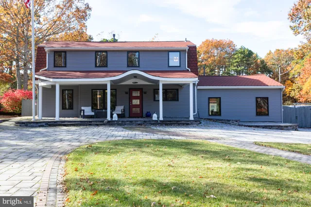 a swimming pool with outdoor seating