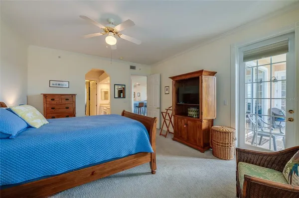 a bedroom with a bed and a couch