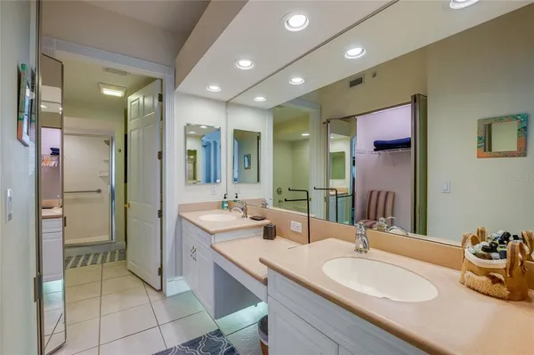 a bathroom with a sink double vanity and a mirror